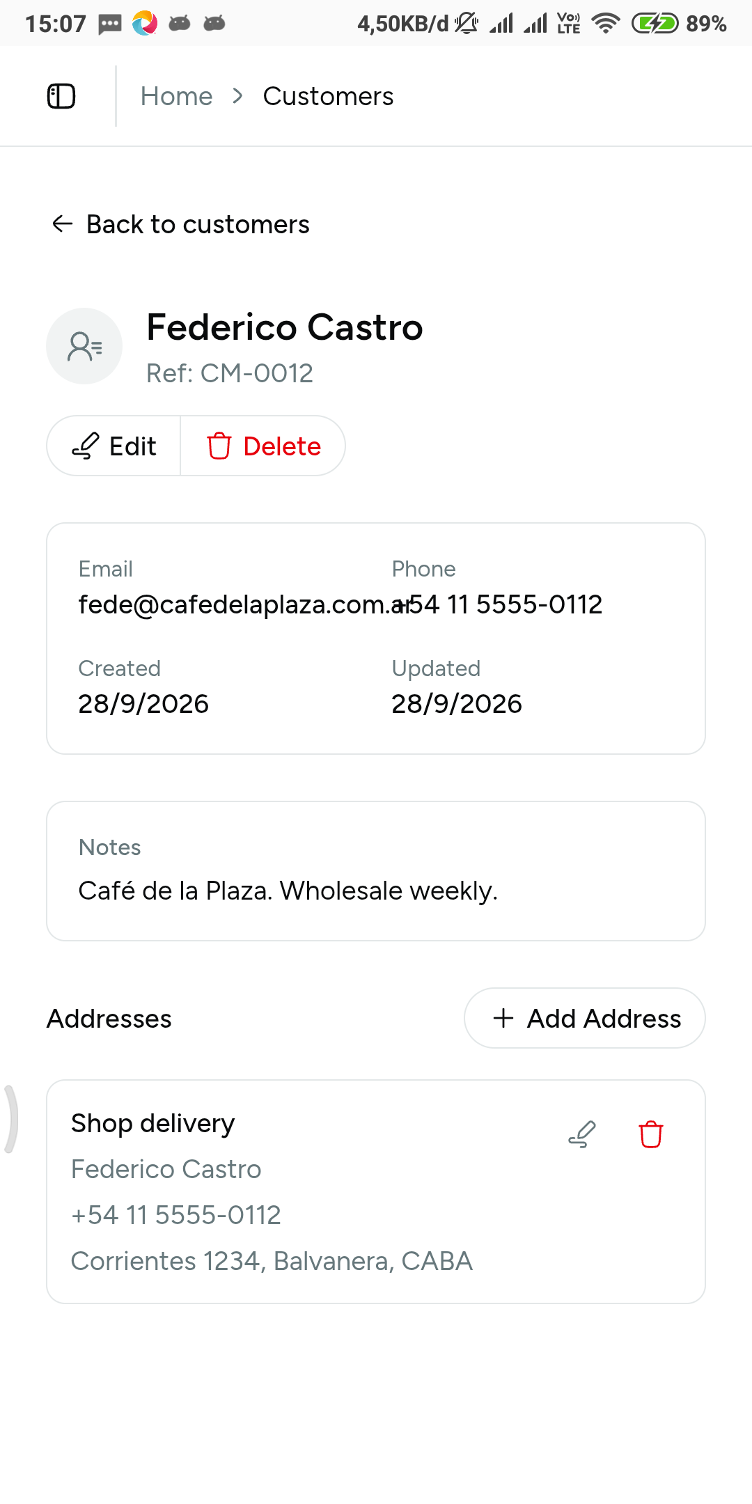 Customer record with contact details, client reference ID, and a labeled saved delivery address